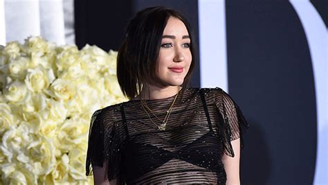 noah cyrus 23 wears a sheer blue dress with nothing underneath for paris fashion week the
