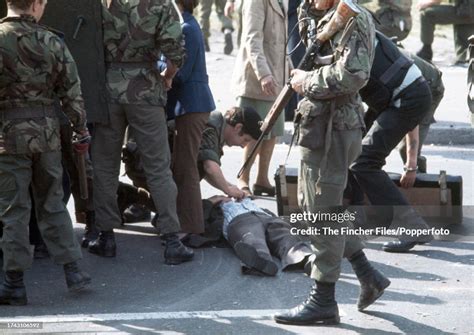 An Injured Civilian Receiving Treatment During Rioting In Belfast