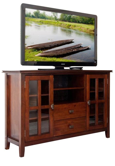 Because, if you place the tv too high or too low, you'll strain your neck tilting your head to compensate. Amazon.com - Simpli Home Artisan TV Stand, 54"W x 35"H ...