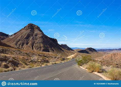 Motorcycles And A Large Rock Along The Road At Lake Mead National