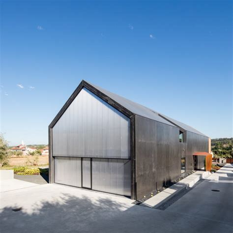 A Black Concrete House In Ourém Aiming To Smoothly Integrate Into The