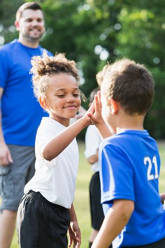 Childrens Soccer Team Opponents Giving Highfives Stock Photo Download