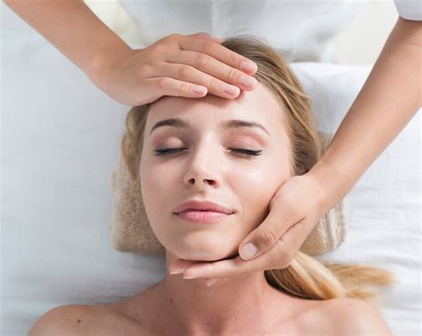 Woman Receiving A Relaxing Facial Massage Free Photo
