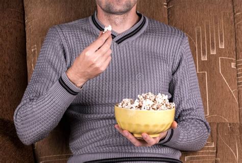 Man Eats Popcorn Stock Photo Image Of Young Control 47932836