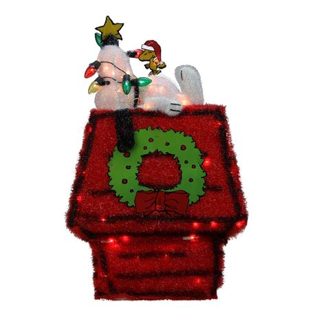 This adorable christmas decoration features snoopy and woodstock dressing up snoopy's dog house with christmas lights. Christmas Peanuts Yard Displays | Christmas Wikii