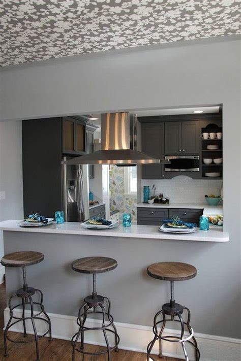 In your kitchen, if you have an island or a peninsula base with no overhead cabinets as part of your counter space, one or more pendant lights can. Kitchen Cabinet Over Peninsula Ideas - Dining Room - Woman ...