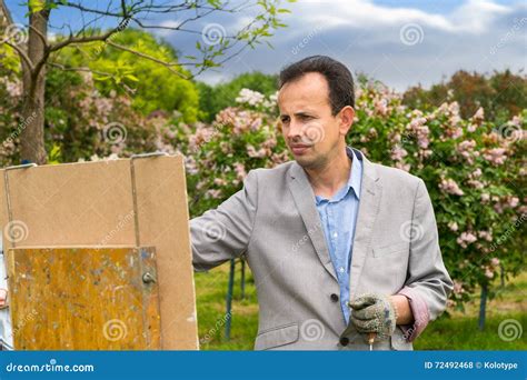 Middle Aged Male Painter In The Process Outdoors Stock Photo Image Of