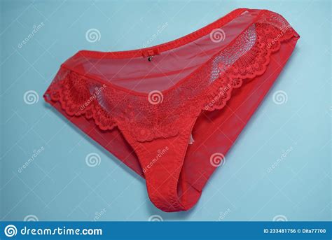 Lingerie In Red On A Blue Background Lacy Scarlet Panties Close Up