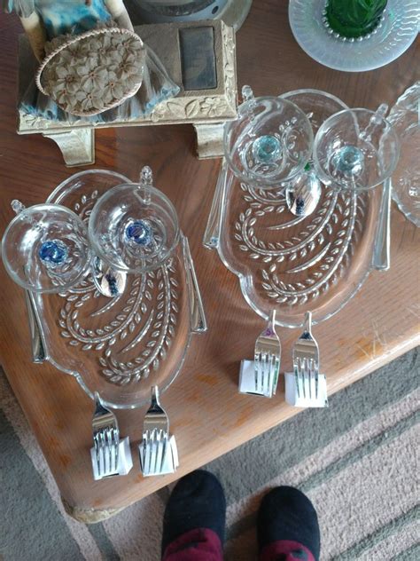 Two Owls Made With Plastic Silverware And Crystal Door Knobs For Eyes