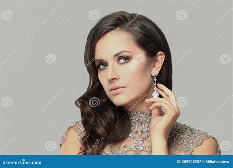 Pretty Glamorous Brunette Model Woman With Makeup And Wavy Hairstyle Wearing Luxurious Diamond