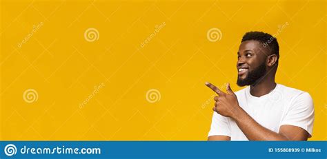 Confident African American Man Pointing At Copy Space Stock Image