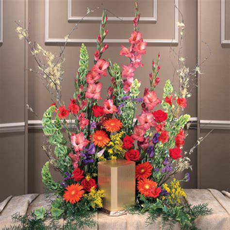 We offer the freshest and most enduring all of our funeral flowers are guaranteed and our customer service cannot be matched. Summer Garden Urn Arrangement - Funeral Service
