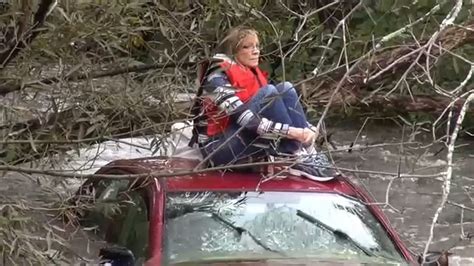 Woman Trapped On Top Of Car During Dramatic Water Rescue In Orange