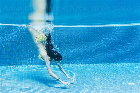Woman Diving Underwater View By Stocksy Contributor Michela Ravasio