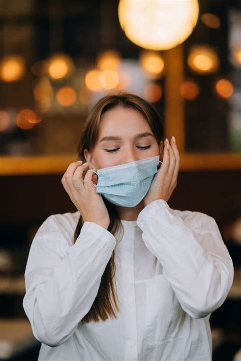 girl in takes off her protective medical face mask stock image image of quarantine female