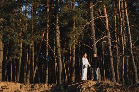 premium photo couple on romantic country walk through woodland