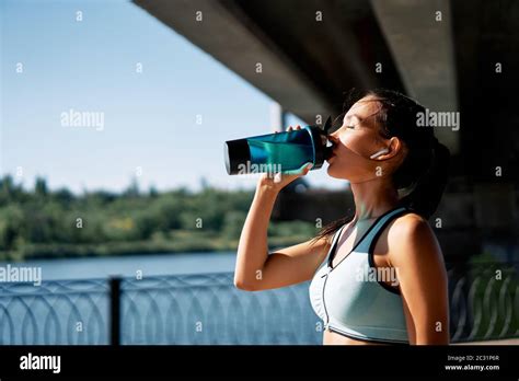 Young Fitness Woman Drinking Water From Bottle Stock Photo Alamy