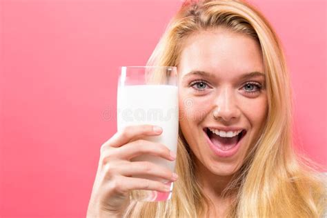 Happy Young Woman Drinking Milk On A Solid Background Stock Image Image Of Milk Drink 115469829