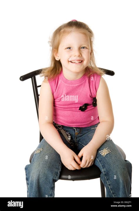 Little Girl Sitting On Chair Isolated On White Stock Photo Alamy