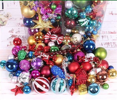 A Pile Of Christmas Ornaments Sitting On Top Of A Table