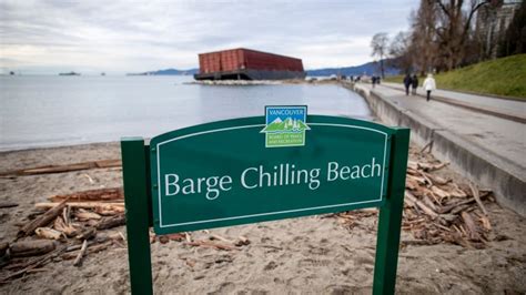 park board installs barge chilling beach sign next to vancouver s runaway barge cbc news