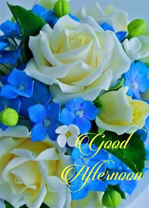 A Bouquet Of Blue And White Flowers With The Words Good Afternoon