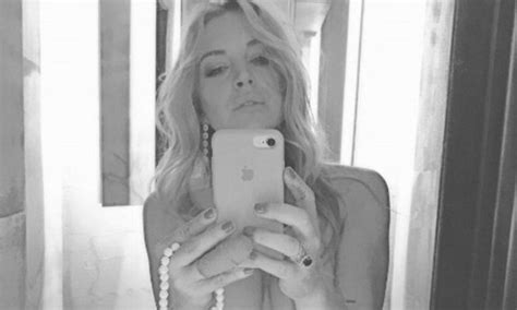 lindsay lohan shares topless instagram selfie as she celebrates opening of greek club daily