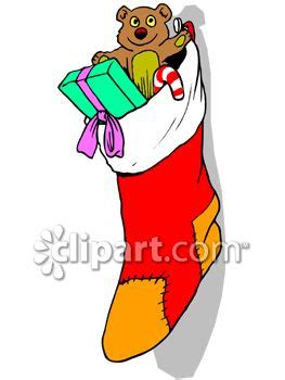 Traditionally a stocking was always stuffed with an orange or tangerines inside.this was meant to represent gold and hopes of wealth. Christmas Stocking Stuffed With Toys And Candy - Royalty ...