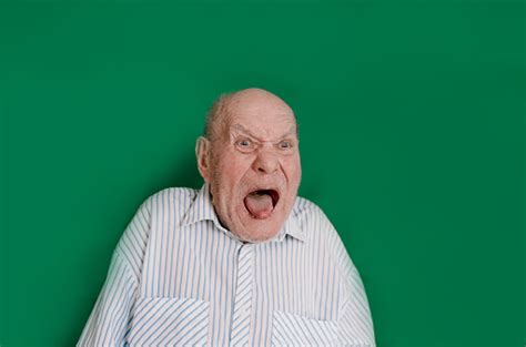 A Large Portrait Of A Crazy Old Man On An Isolated Green Background