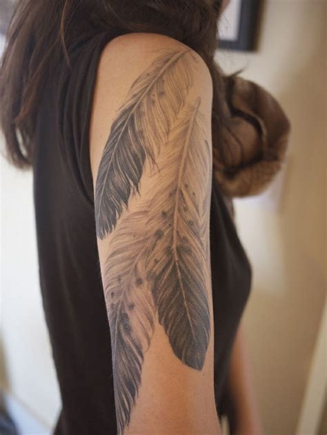 Feather Tattoo On Back Of Arm