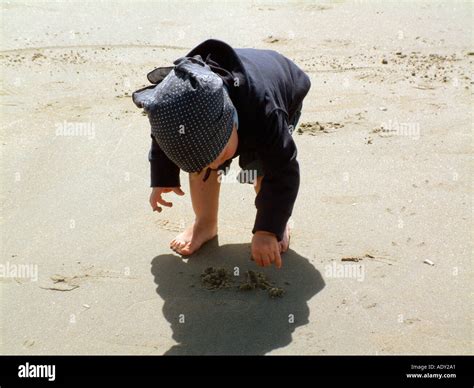 Boy Picking Shells Hi Res Stock Photography And Images Alamy