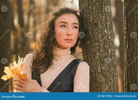 Attractive Young Woman Walking In Autumn Park Happy Mood And Fashion