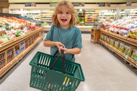 Child With Shopping Basket Shopping In Supermarket Kids Buying