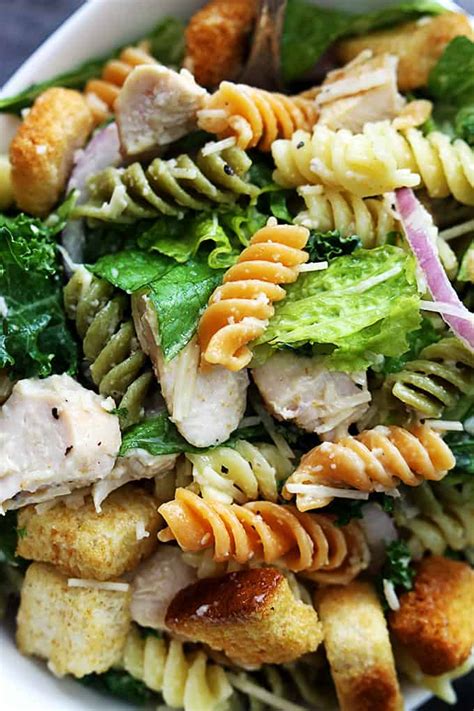 You're most likely heating the grill anyway, so you might as well make some of this scrumptious dish. Chicken Caesar Pasta Salad | Creme De La Crumb