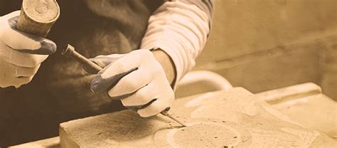 Man Carving Into Stone Limestone