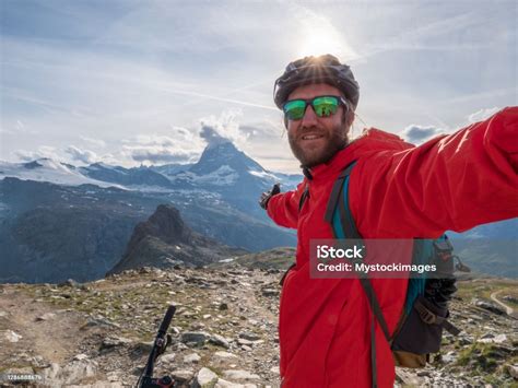 Mountain Biker Takes Selfie With Matterhorn Mountain Stock Photo