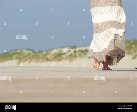 One Woman Walk Barefoot Hi Res Stock Photography And Images Alamy