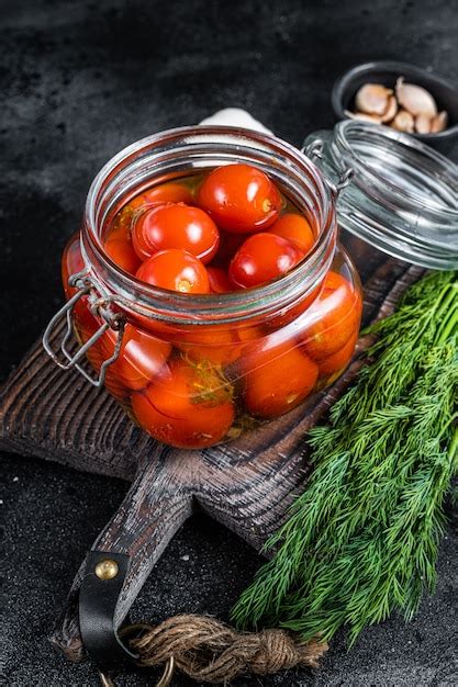 Premium Photo Pickled Cherry Tomatoes In A Glass Jar With Herbs