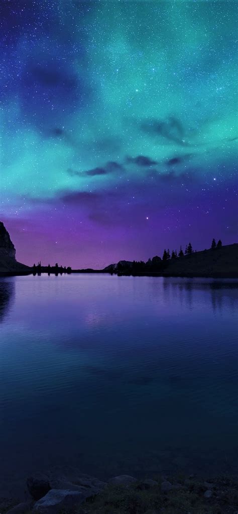 828x1792 Aurora Borealis Northern Lights Over Mountain Lake 828x1792