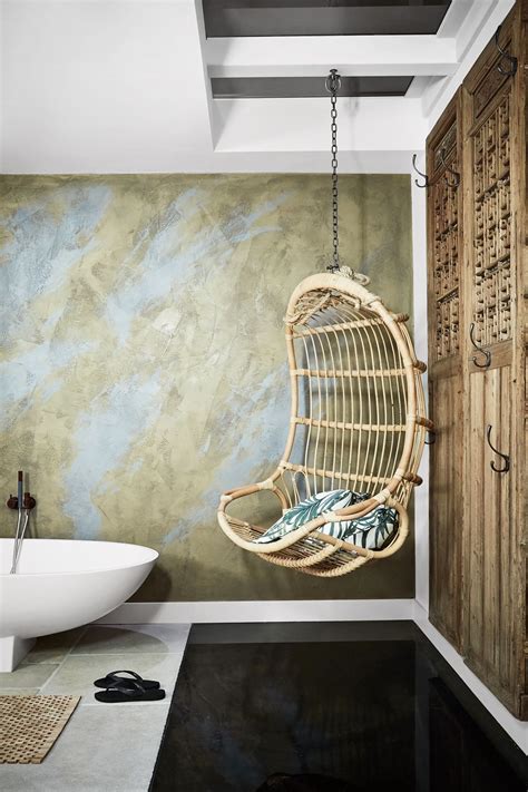 Browse inspirational photos of modern bathrooms. hanging rattan chair in bathroom #bathroomideasurban ...