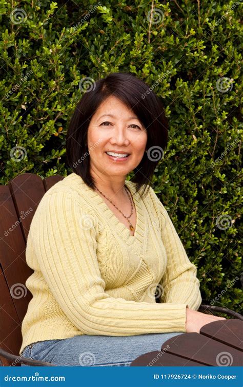 Beautiful Mature Asian Woman Sitting Outside Stock Photo Image Of Adult Confidence