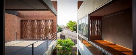 Perforated Brick Screens Create Private Space Amidst Busy Bangkok Streets