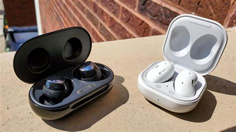 A black galaxy buds plus charging case opens and the pair of earbuds float upwards out of the case. Samsung Galaxy Buds Live vs Galaxy Buds Plus: Which ...