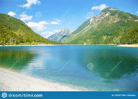 Lake Predil With Turquoise Water And Mountains In Background Near