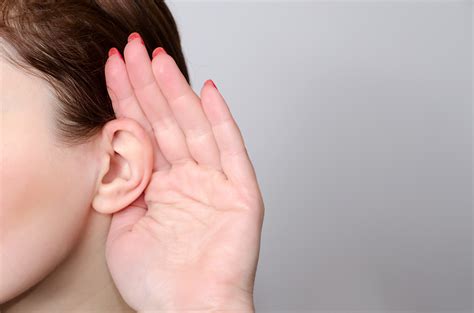 Person Placing Hand Behind Ear Listening