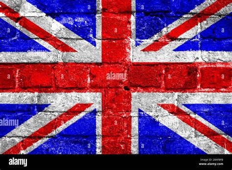 United Kingdom Union Jack Flag With A Worn Brick Wall Texture Stock