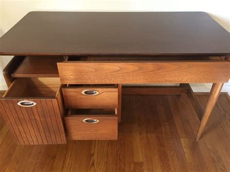 I've done a lot of searching for you and have found some incredible desks that will fit perfectly in the majority of bedrooms. Vintage Mid-Century Walnut Desk by Hooker - EPOCH