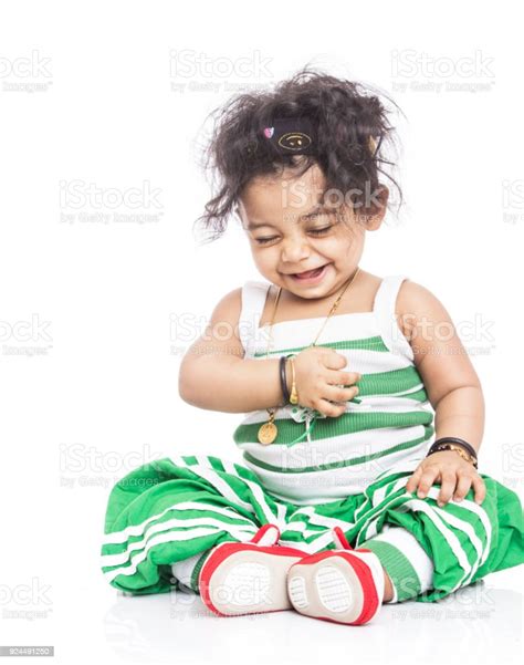 Cute Indian Baby Girl Playing On White Stock Photo Download Image Now