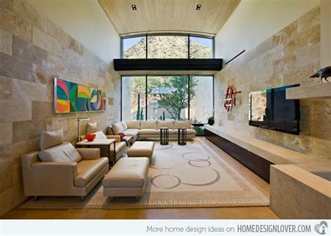 A Large Living Room With High Ceilings And Modern Furniture