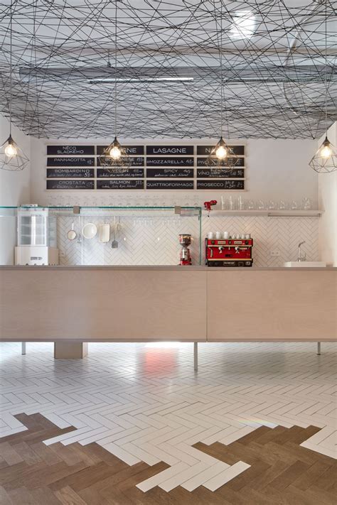 Black String Was Used To Create A Suspended Ceiling In This Bistro